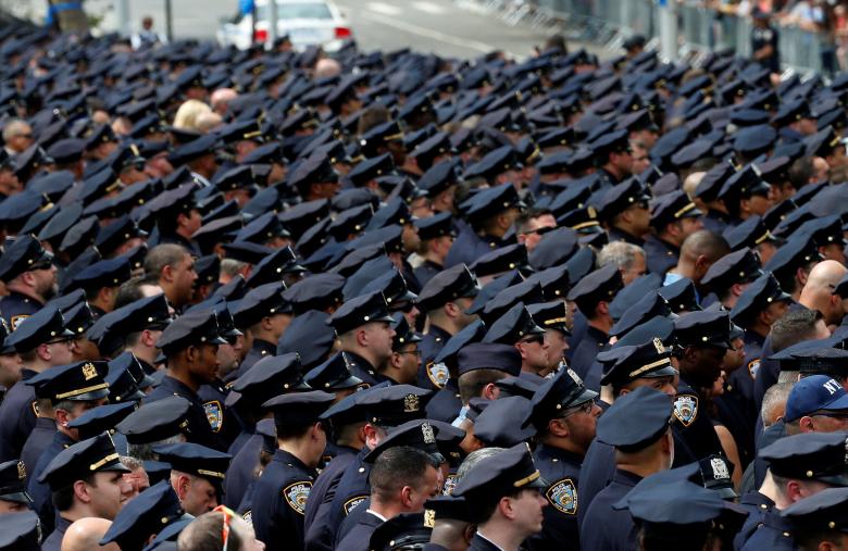 Police officers gather for the funeral service for slain New York City Police Department (NYPD) officer Miosotis Familia in the Bronx borough of New York City