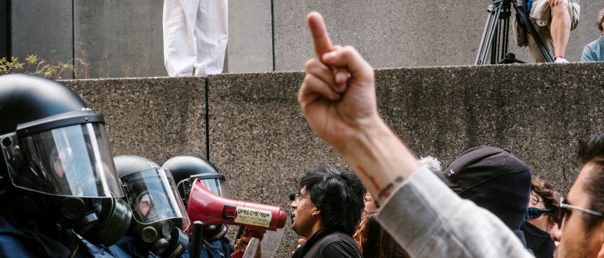 Counter-protesters are held back by police