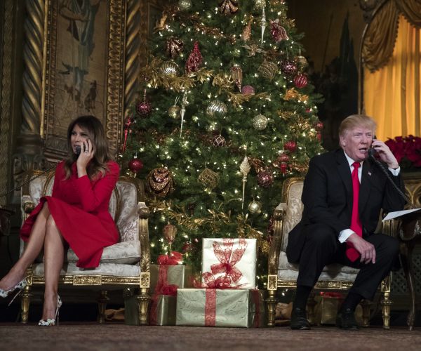 President Donald Trump and first lady Melania Trump speak on the phone with children as they track Santa Claus' movements