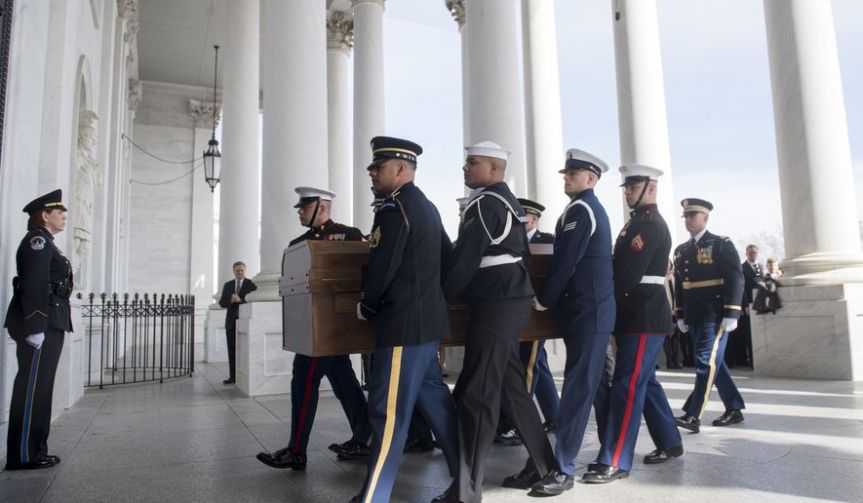 A Military Honor Guard carries the casket of Reverend Billy Graham