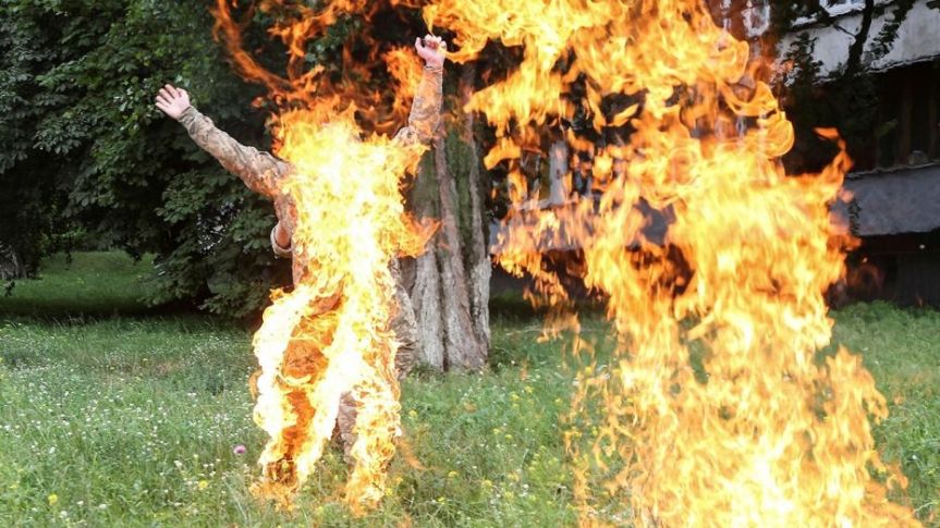 Ukrainian serviceman Serhii Ulianov sets himself on fire.  (Reuters)