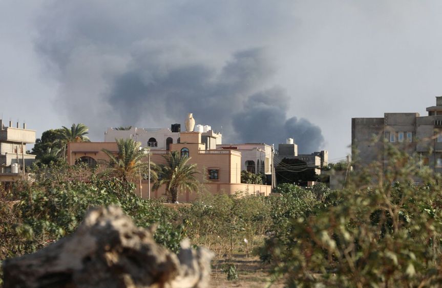 Smoke rises during heavy clashes between rival factions in Tripoli,