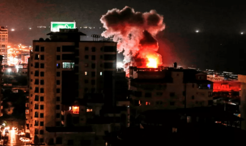 A fireball exploding during Israeli air strikes in Gaza City, August 8, 2018