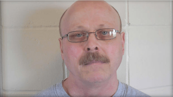 Carey Dean Moore, 60, appears in a police booking photo released in Lincoln