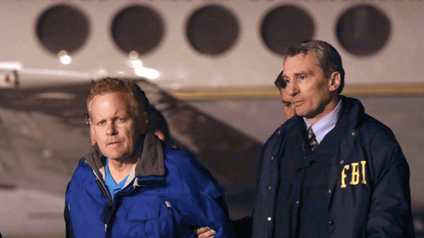 fugitive lawyer Eric Conn, left, is taken into custody by FBI agents 