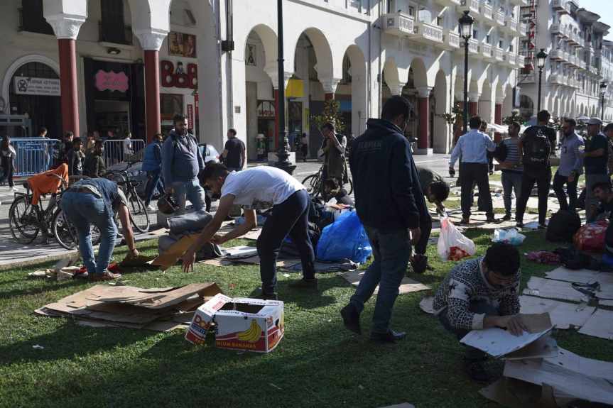 Migrants clear the Aristotelous Square in the northern Greek city of Thessaloniki,