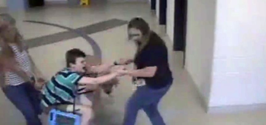 child-with-autism-dragged-thru-school