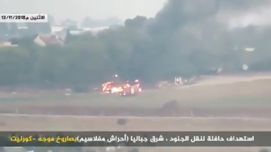 A bus burns near Kfar Aza, Israel, on November 12, 2018, after being hit by an anti-tank guided missile fired