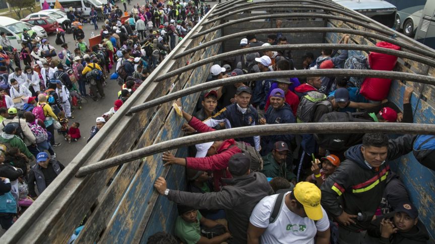 Central American migrants travel on a truck after hitching a ride in Tepotzotlan, Mexico, 