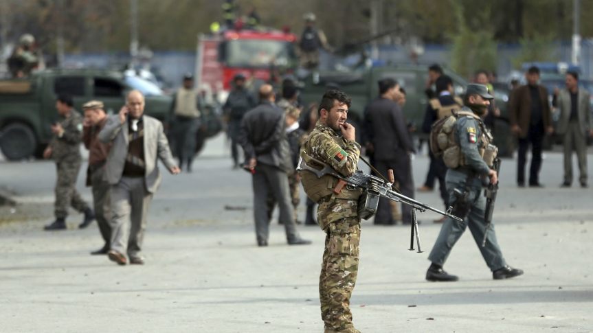 Security forces inspect the site of a deadly blast 