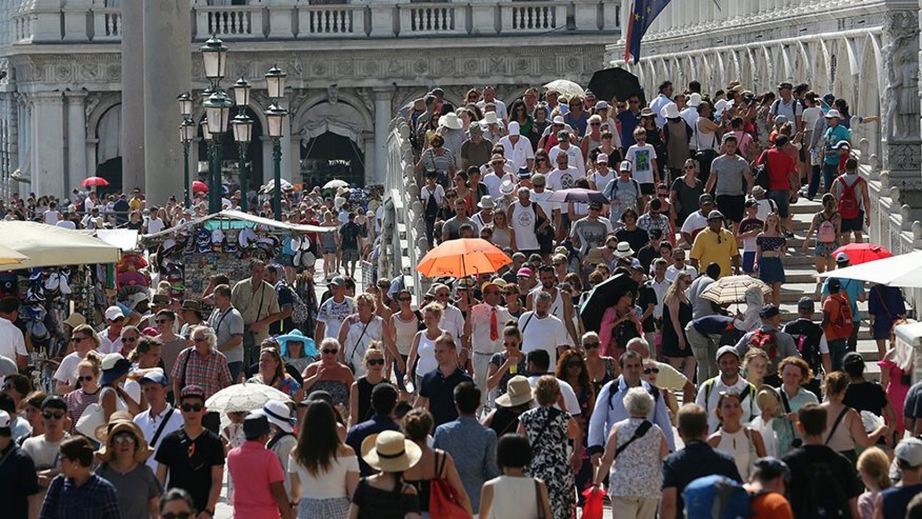 Tourists walk near St. Mark's Square in Venice,