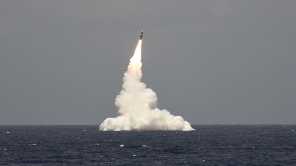 An unarmed Trident II D5 missile launches from the Ohio-class ballistic missile submarine USS Rhode Island