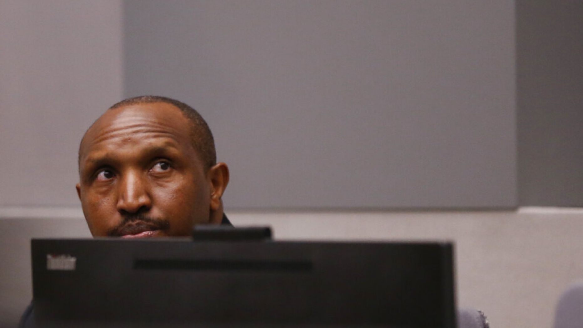 Congolese militia commander Bosco Ntaganda sits in the courtroom of the ICC 