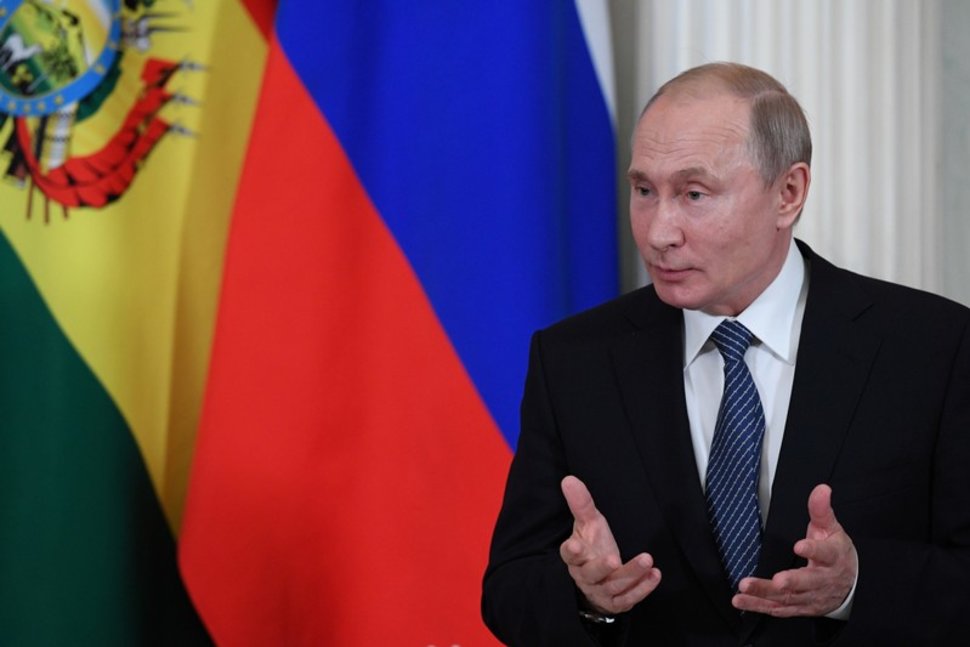 Russian President Vladimir Putin speaks as he meets with his Bolivian counterpart at the Kremlin in Moscow,