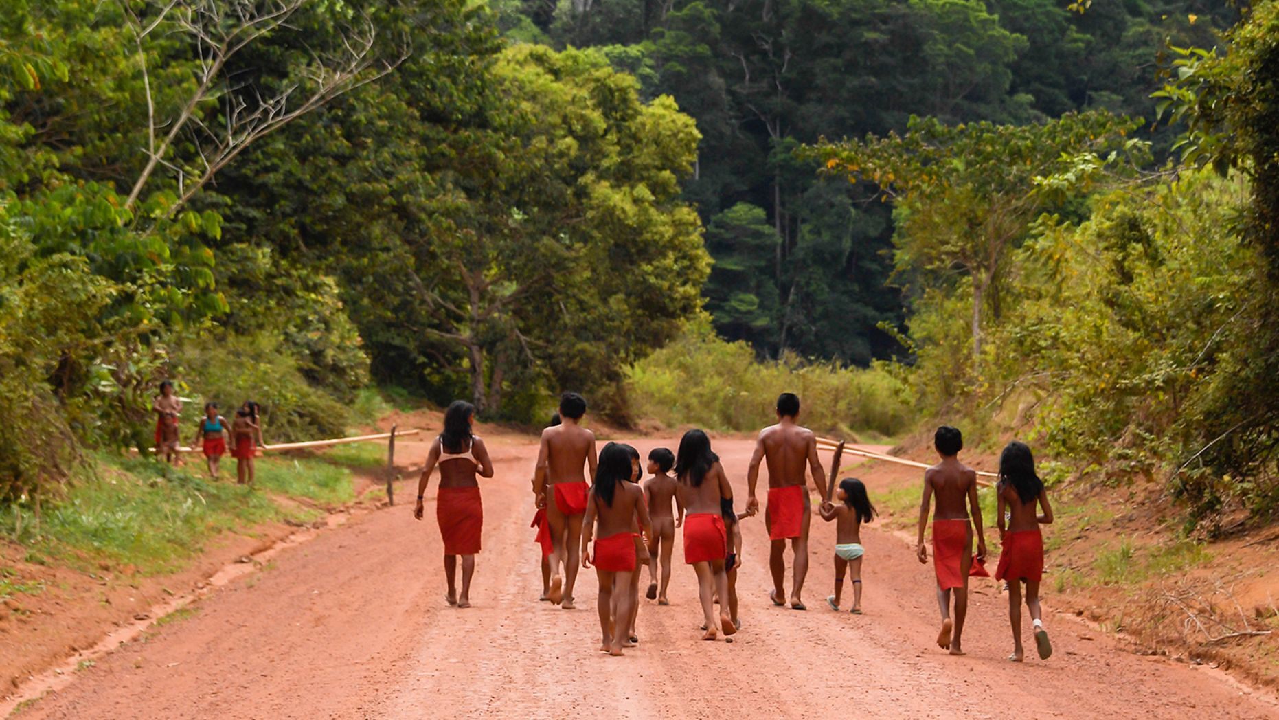 Brazilian Waiapi walk on the road of the Waiapi indigenous reserve,