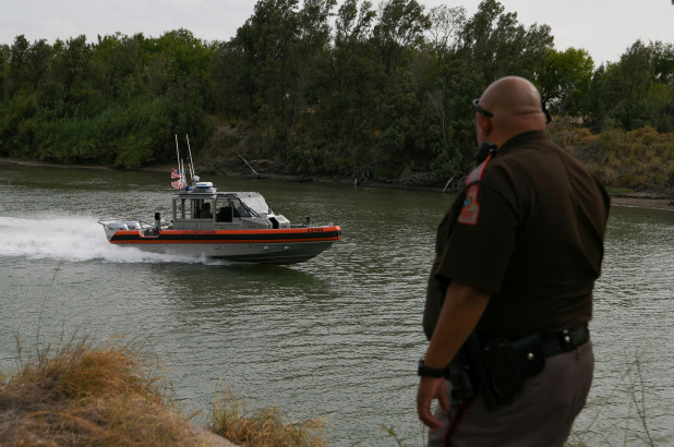 A U.S. Coast Guard boat deployed for U.S.-Mexico border security operations navigates the Rio Grande.