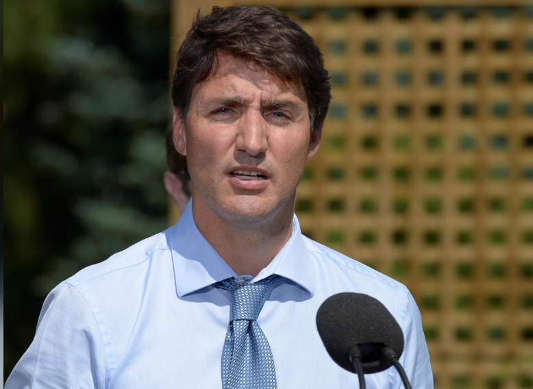 Canada's Prime Minister Justin Trudeau speaks about a watchdog's report that he breached ethics rules