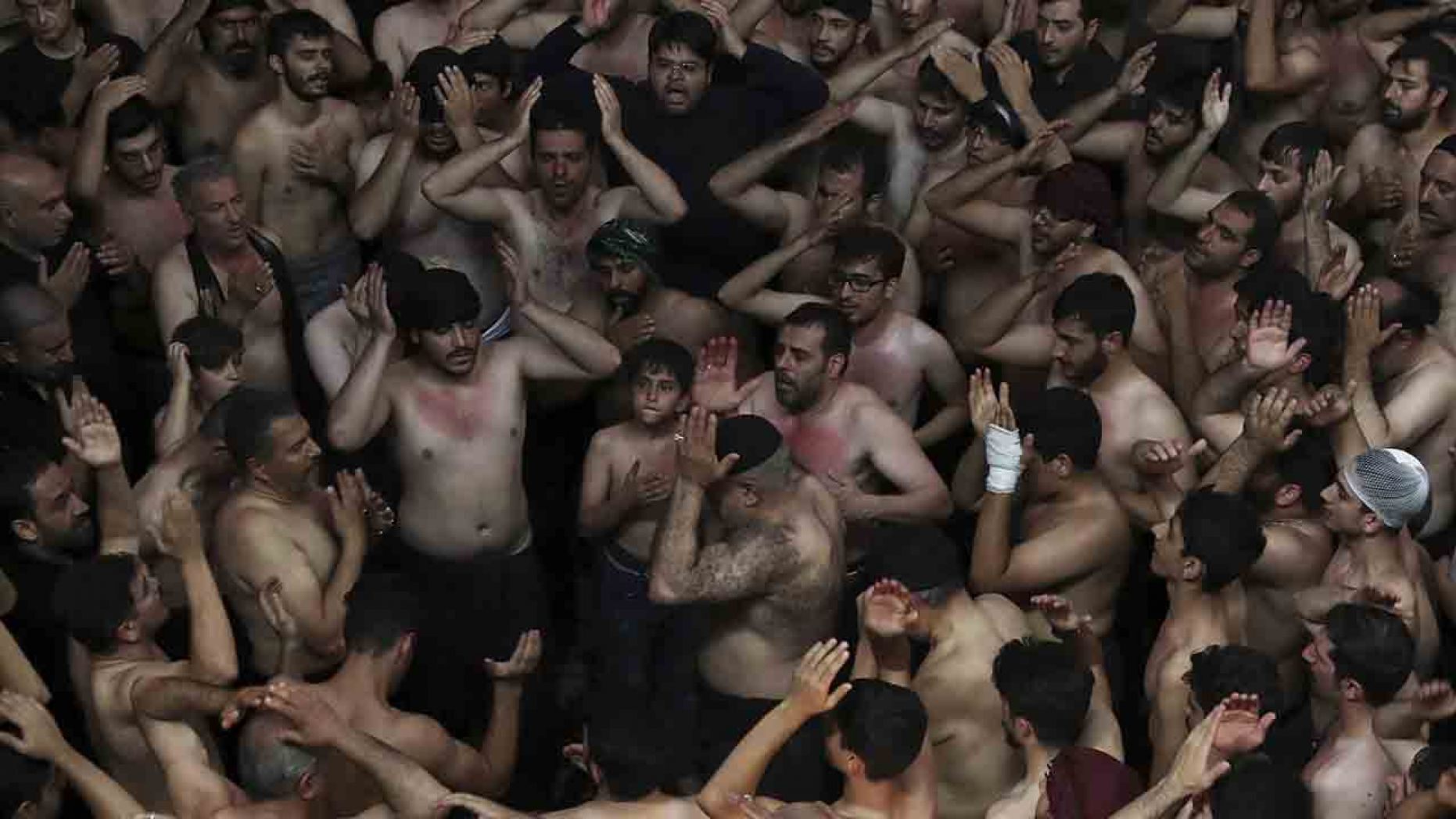 Iranian and Iraqi Shiite Muslims beat their heads during a mourning ceremony marking Ashoura in downtown Tehran, Iran, Tuesday, Sept. 10, 2019