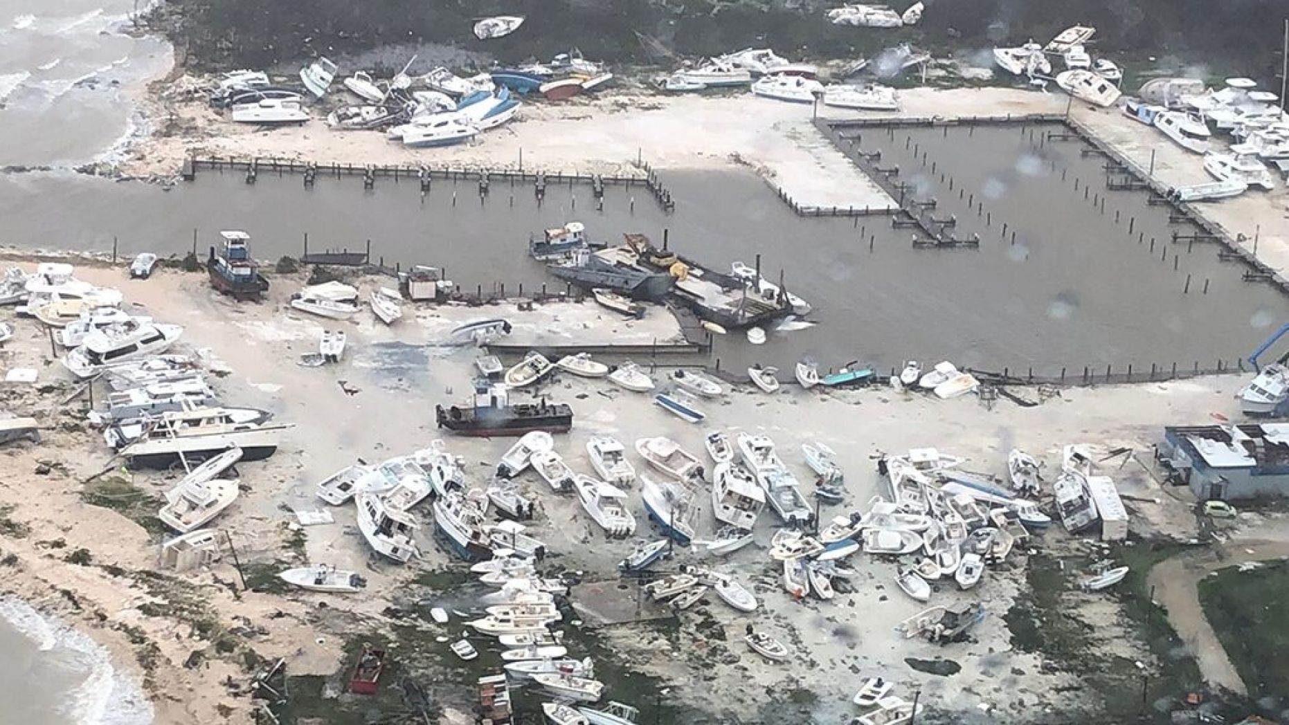 Coast Guard Air Station Clearwater forward-deployed four MH-60 Jayhawk helicopter crews in support of search and rescue and humanitarian aid in the Bahamas, Sept. 2, 2019.