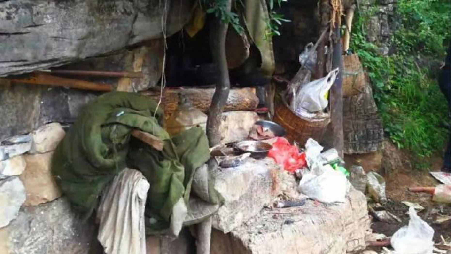 The drones spotted household rubbish strewn around the cave where Song JIang was found hiding after 17 years on the lam.