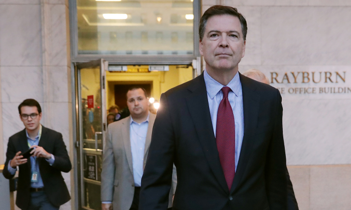 Former Federal Bureau of Investigation Director James Comey leaves the Rayburn House Office Building