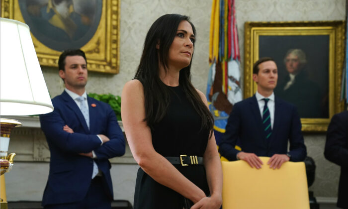 White House Press Secretary Stephanie Grisham listens during a signing of a “safe third country” agreement in the Oval Office of the White House in Washington on July 26, 2019.