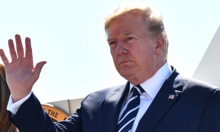 President Donald Trump waves