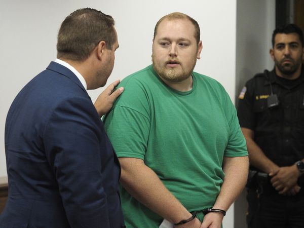 Defense attorney Matthew Teeter, left, speaks with his client Kenneth C. Saal, 30, of Lindenwold during a court hearing on August 23, 2019.