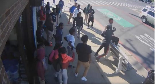 An image from a video of an assault at a bus stop in the the 17100 block of E. Warren on Oct. 10, 2019. Detroit police are looking for the suspects.