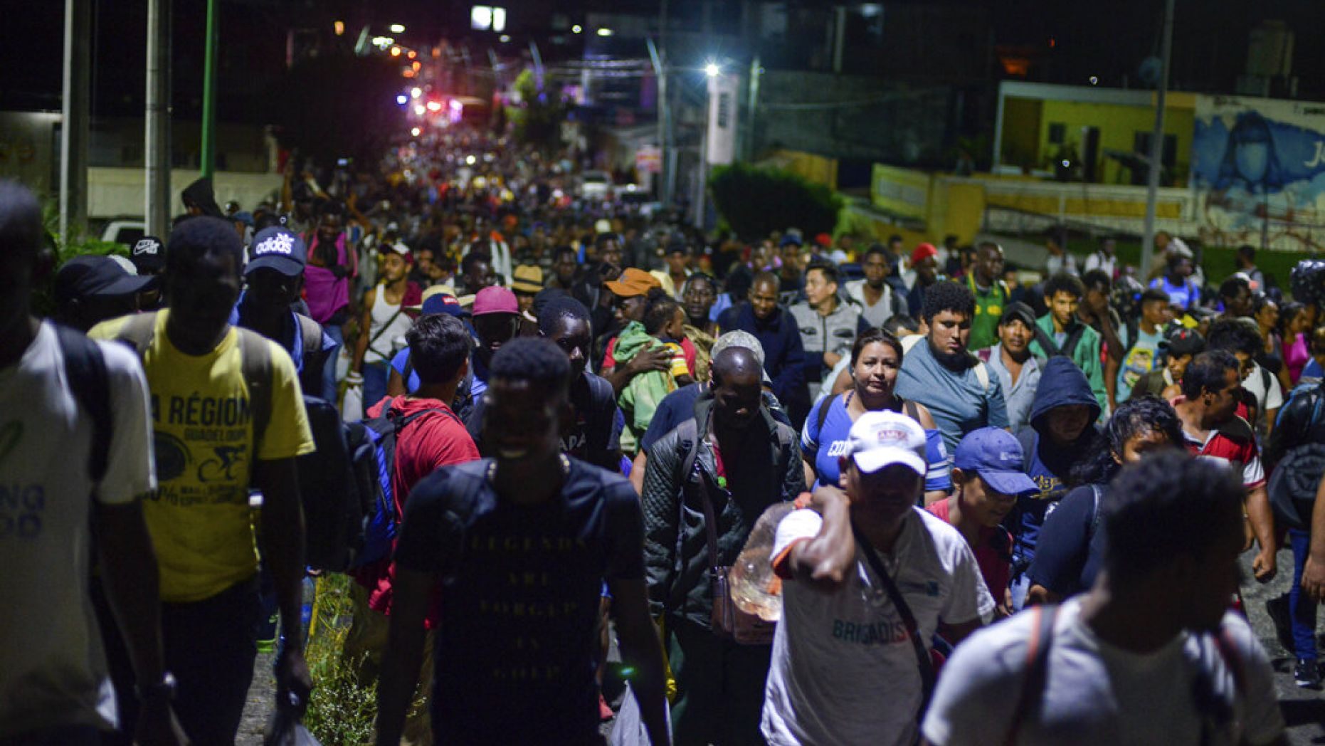 Migrants depart early in the morning from Tapachula, Chiapas state, Mexico, Saturday, Oct. 12, 2019.