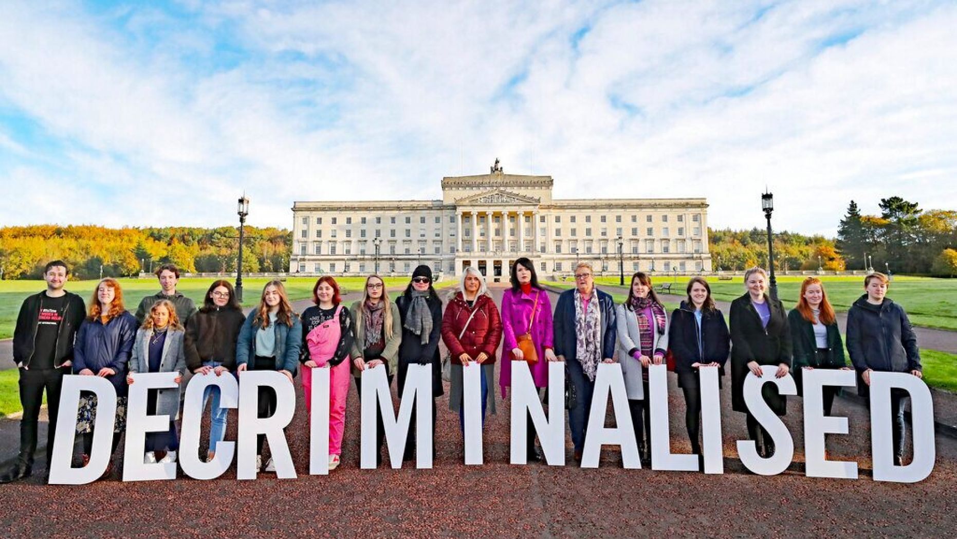 Pro-choice activists take part in a photo call in the grounds of Stormont Parliament, Belfast, Monday Oct. 21, 2019. 