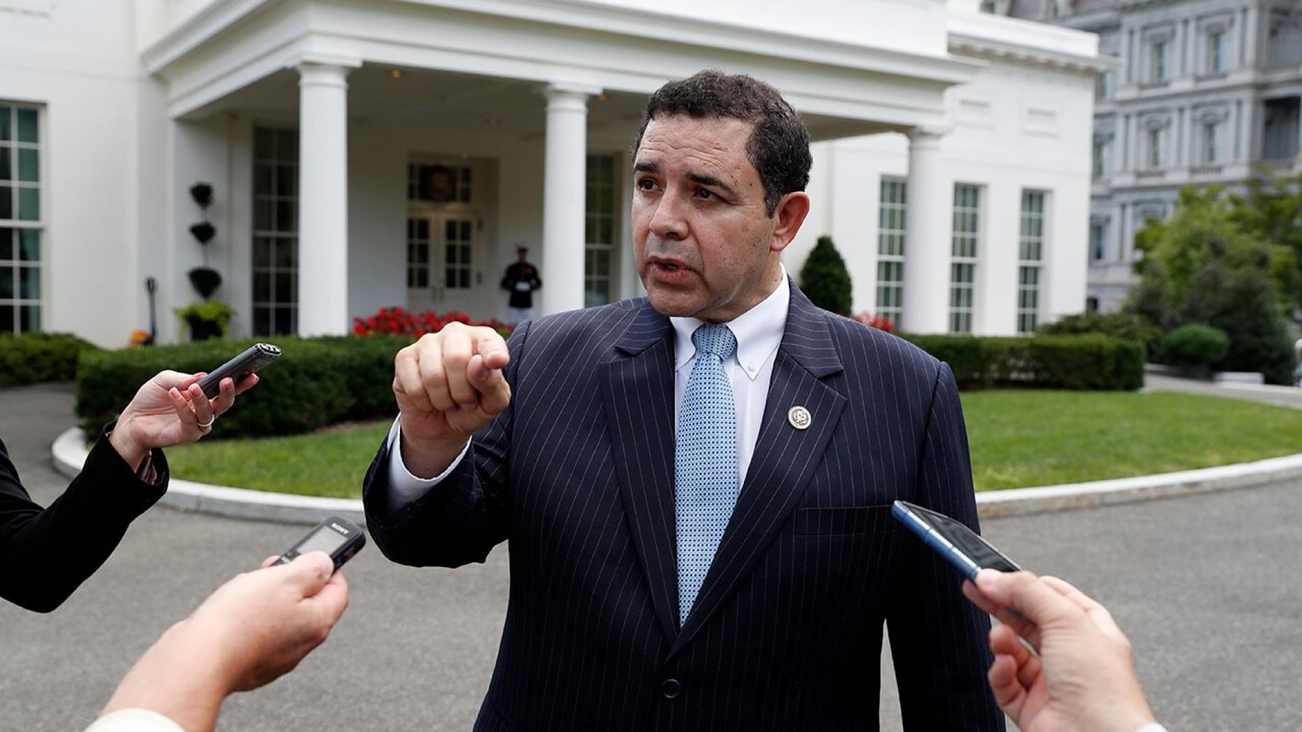 Rep. Henry Cuellar, D-Texas, speaks with the media in front of the West Wing after a bipartisan meeting with President Donald Trump at the White House, Wednesday, Sept. 13, 2017, in Washington. 