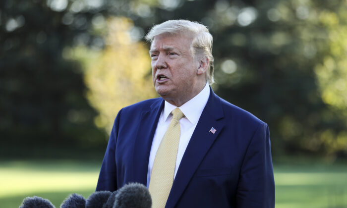 President Donald Trump speaks to media before departing the White House on Marine One on Oct. 11, 2019.