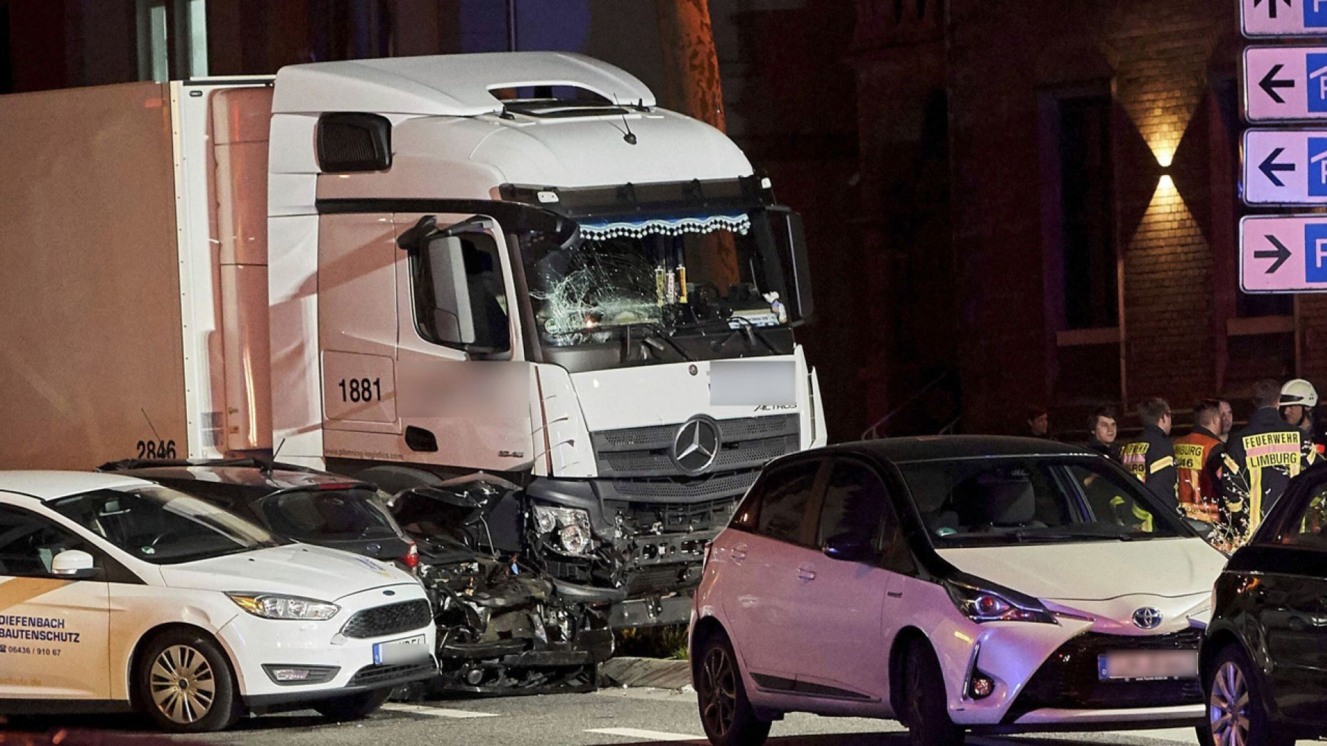 In this Monday, Oct. 7, 2019 photo s truck stands between damaged cars in Limburg, Germany. 