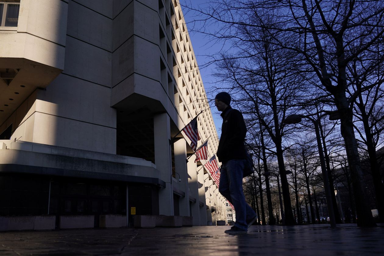 A pedestrian walking past the headquarters of the Federal Bureau of Investigation in Washington. 