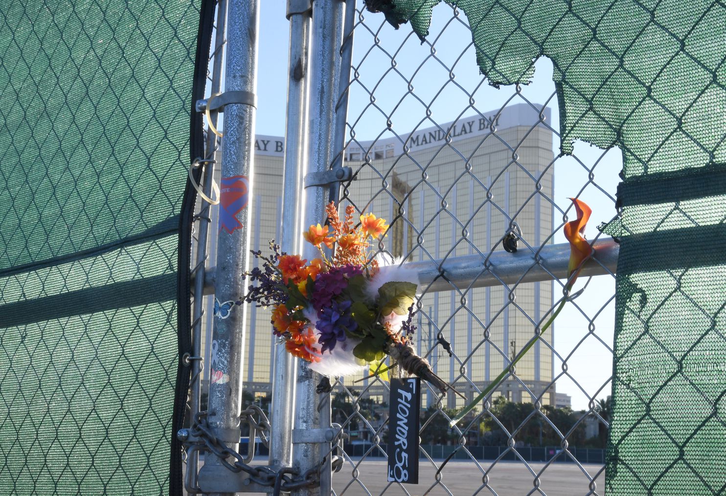 Flowers honoring the Las Vegas shooting victims rest on a fence near the Mandalay Bay Resort and Casino on Monday, a day before the second anniversary of the massacre. 