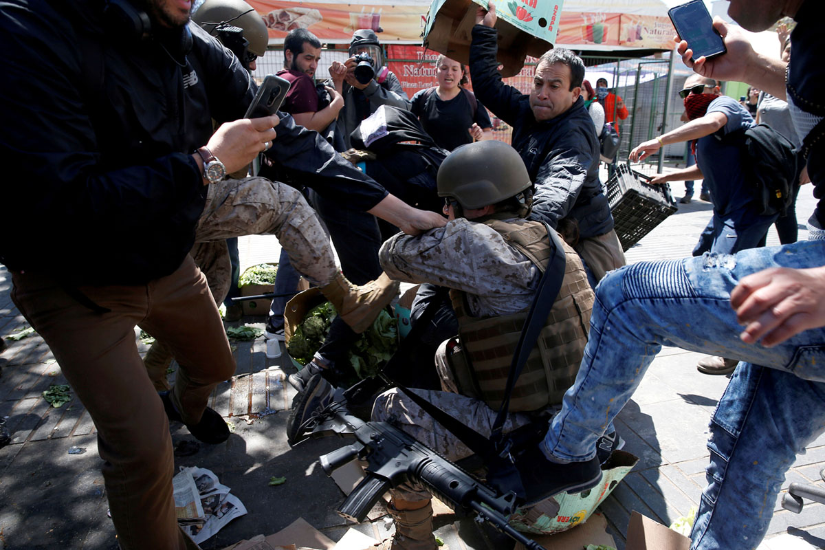Demonstrators clash with members of the security forces during a protest in Valparaiso on October 21, 2019. #17