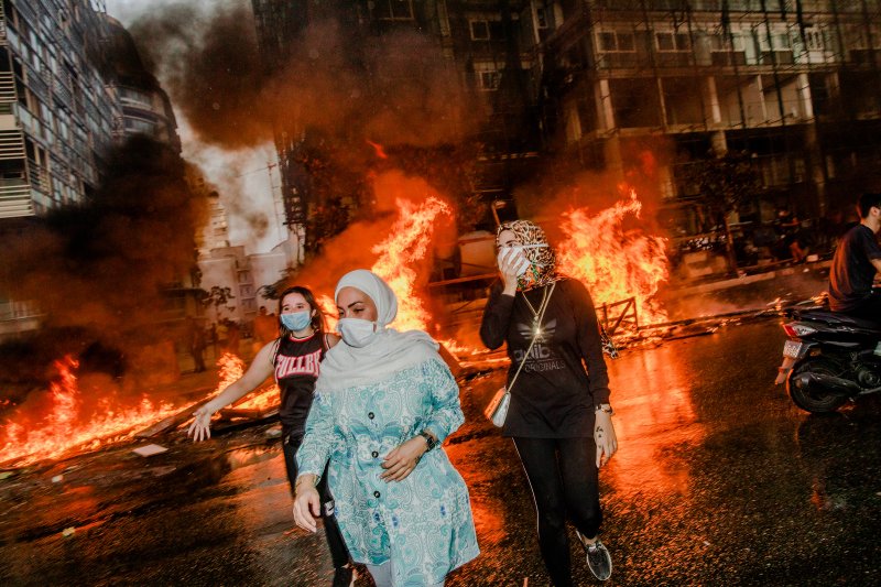 Nour, Nour and Farah attend a mass protest in Beirut on Oct. 18, 2019.