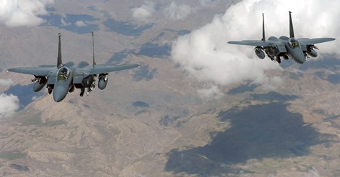 Two U.S. Air Force F-15E Strike Eagle jets fly in formation June 12, 2009, during a combat mission over Afghanistan.