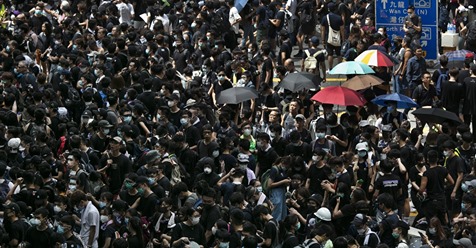 Thousands of protesters surround the police headquarter in Hong Kong on June 21, 2019. The protests continue as the demonstrators are demanding that Chief Executive Carrie Lam step down and call for a complete withdrawal of a controversial extradition bill