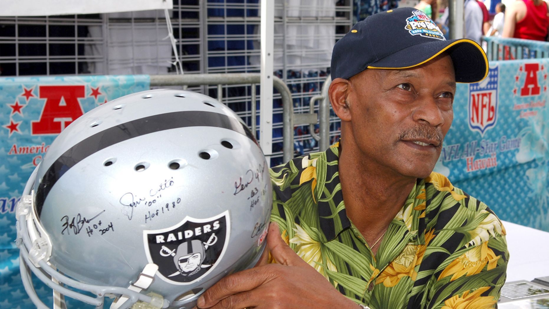 Willie Brown holds an autographed Riddell Raiders helmet at the Pro Bowl Footbal Festival at Kapiolani Park in Honolulu, Hawaii on Saturday, February 11, 2006.