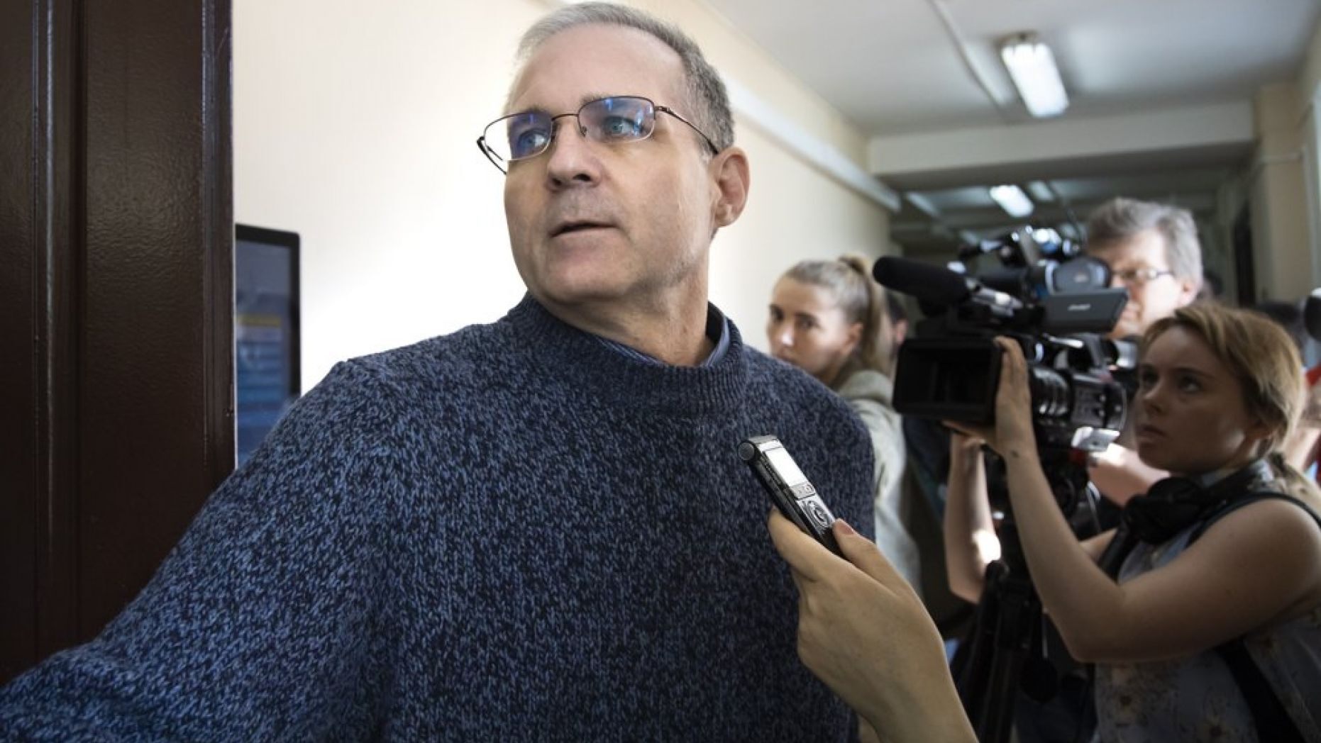 Paul Whelan is escorted by Federal Security Service officers to a courtroom in Moscow, Russia, on Aug. 23, 2019.