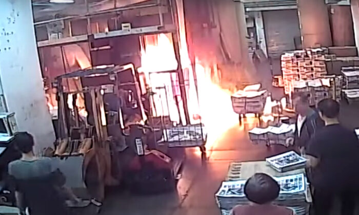 CCTV footage of the fire set by masked intruders at the printing press of The Epoch Times Hong Kong bureau on Nov. 19, 2019.