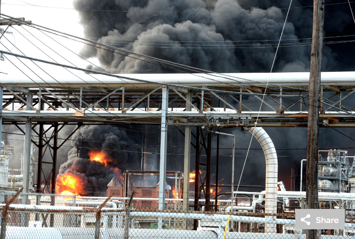 Thick smoke fills the sky above the TPC Group Port Neches Operations as emergency response crews try to contain the fire that continued to burn throughout the morning following an overnight explosion on Wednesday, Nov. 27, 2019,