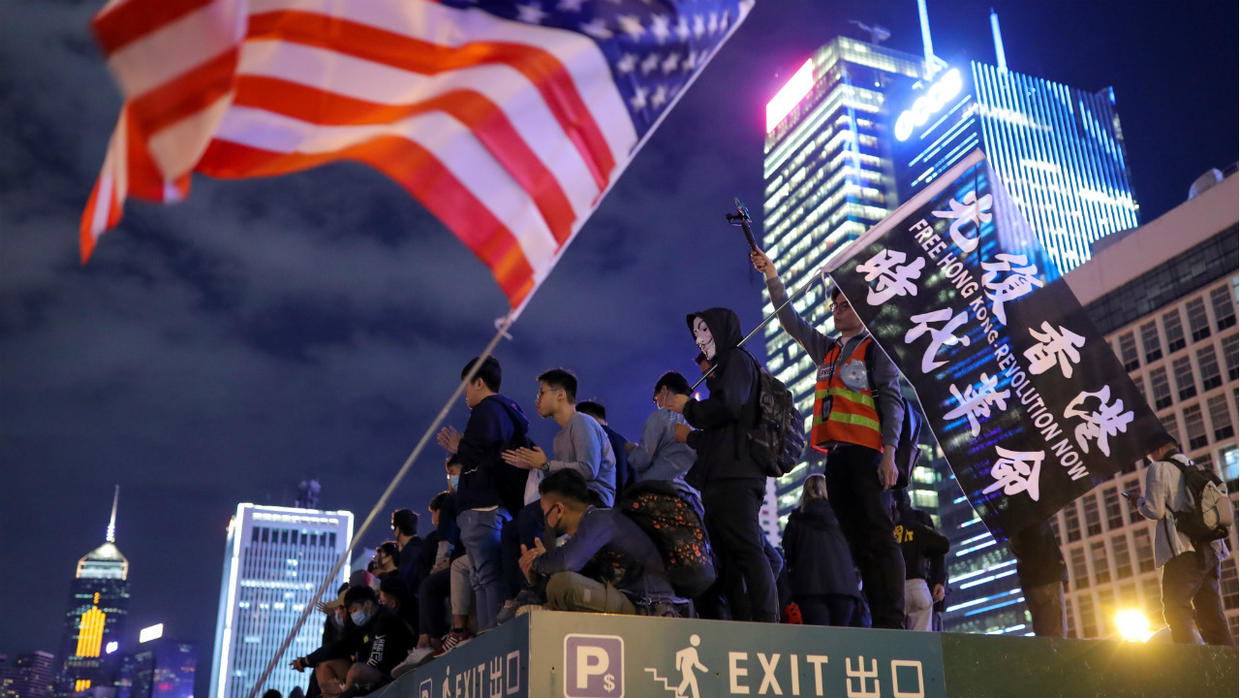 PROTESTS/THANKSGIVING Protestors attend a gathering at the Edinburgh place in Hong Kong Protesters stand next to a US flag as they attend a gathering at Edinburgh Place in Hong Kong, China, on November 28, 2019.