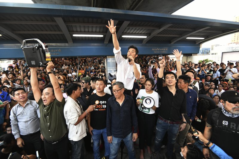 FILE - In this Dec. 14, 2019, file photo, Thailand's Future Forward Party leader Thanathorn Juangroongruangkit talks to his supporters during rally in Bangkok, Thailand. A statement from Thailand's Constitutional Court says it will rule on a sedition case against the popular Future Forward Party that links it to what conspiracy theorists call the Illuminati, 