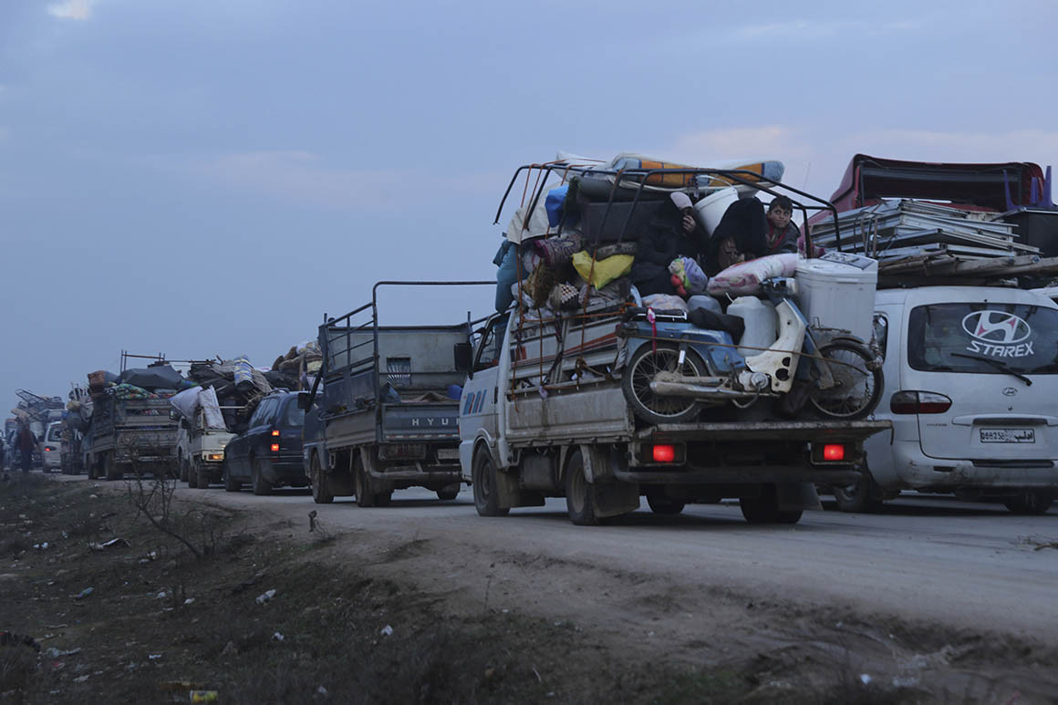 Truckloads of civilians flee a Syrian military offensive in Idlib province on the main road near Hazano, Syria on Tuesday. 