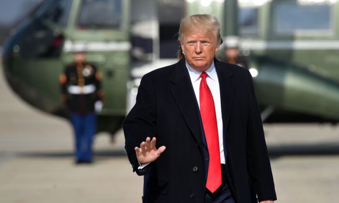President Donald Trump makes his way to board Air Force One before departing from Andrews Air Force Base in Maryland on Nov. 20, 2019. 