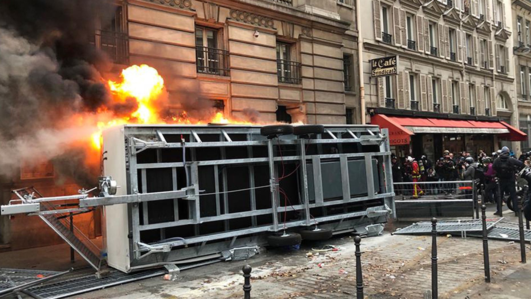 A truck is set ablaze during a demonstration in Paris on Thursday.