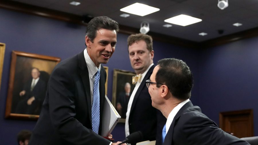 (L) Tom Graves (R-Ga.) greets Treasury Secretary Steven Mnuchin before a hearing in the Rayburn House Office Building on Capitol Hill in Washington on June 12, 2017. 